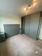 Reed green wardrobe and integrated headboard and bedside cupboards, fitted in New Marske